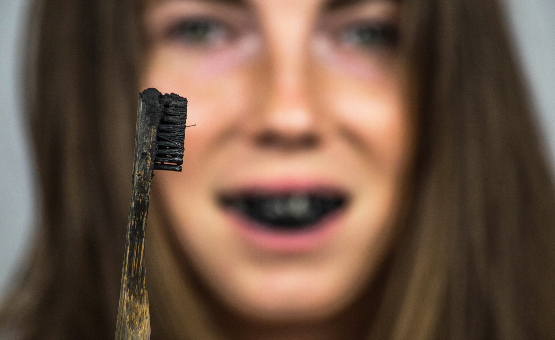 The risks and dangers of charcoal teeth whitening products